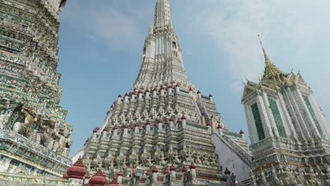 4k cinematic religious travel scenic footage of the buddhist temple of wat arun in the old town of bangkok, thailand on a sunny day