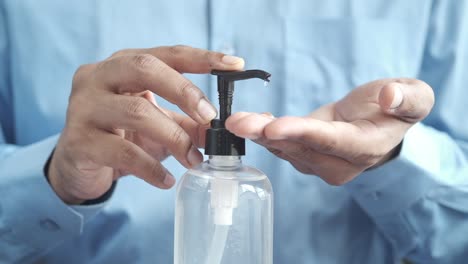 applying hand sanitizer