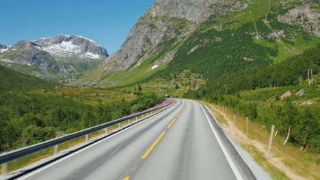 go along the scenic road among the mountains of norway first-person view