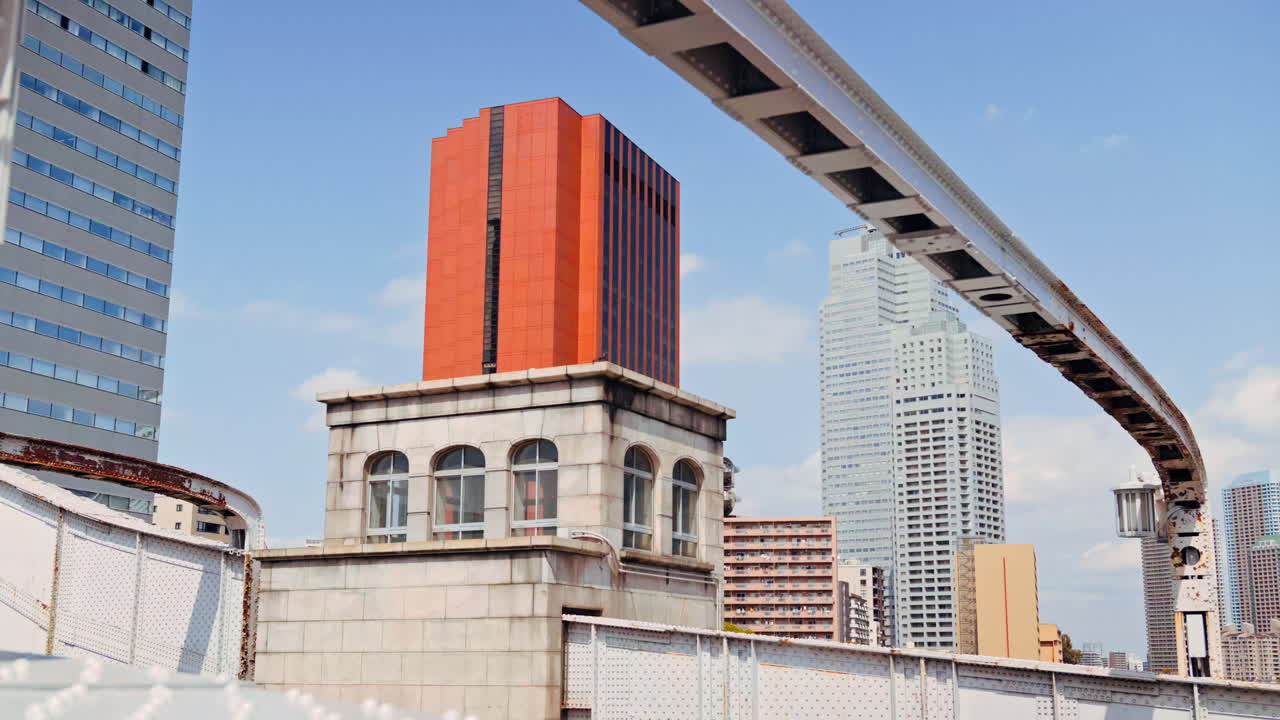 View of buildings in Chuo, Japan from the Kachidoki Bridge in daylight