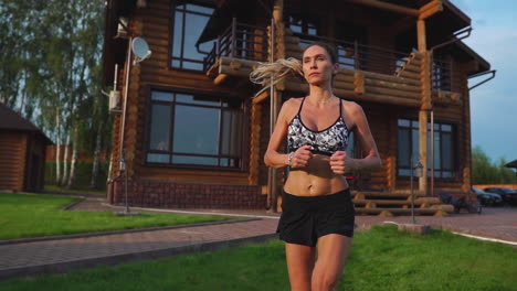 healthy lifestyle. girl running around in the morning in a premium residential area