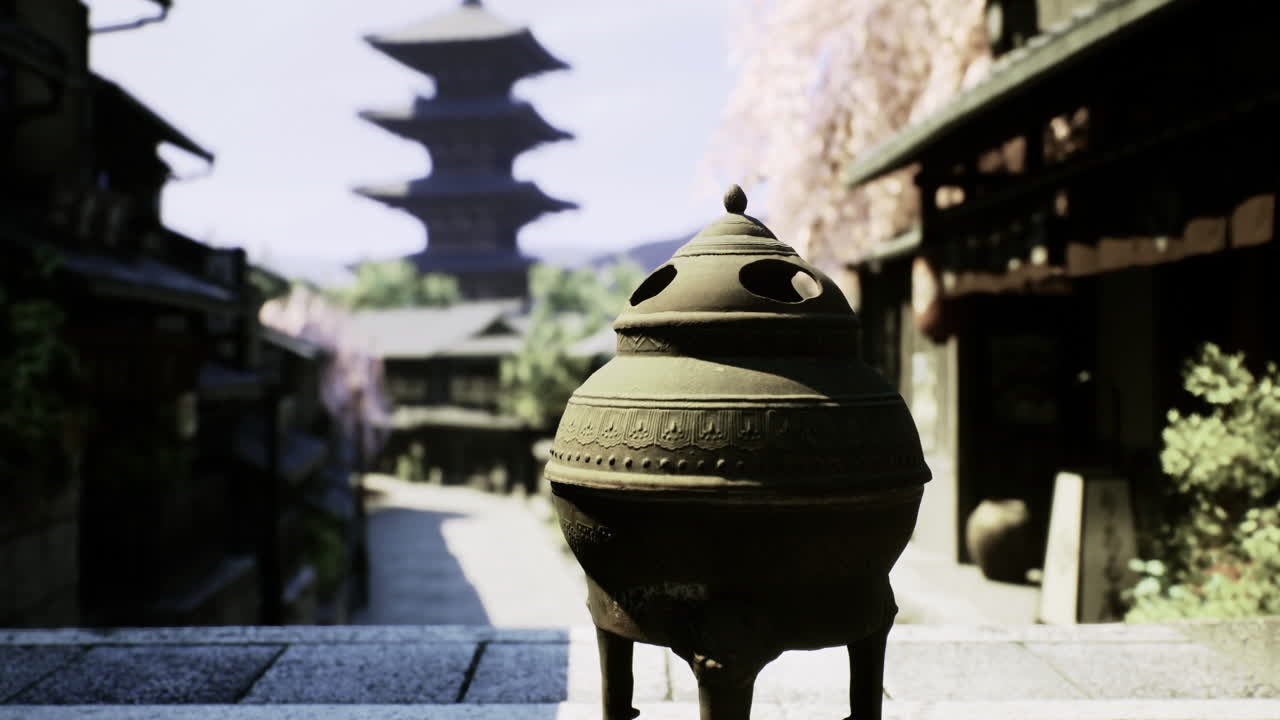 Traditional incense burner in a historic japanese street during spring