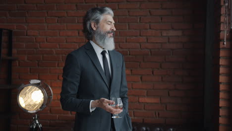 mature businessman with a drink