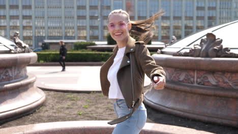 woman enjoying a sunny day in the city park