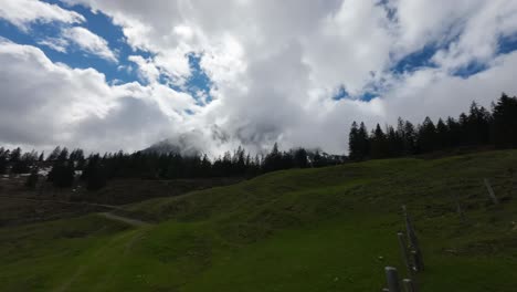 Timelapse-of-Clouds-Flying-over-Mountain-in-Austrian-Alps,-Europe