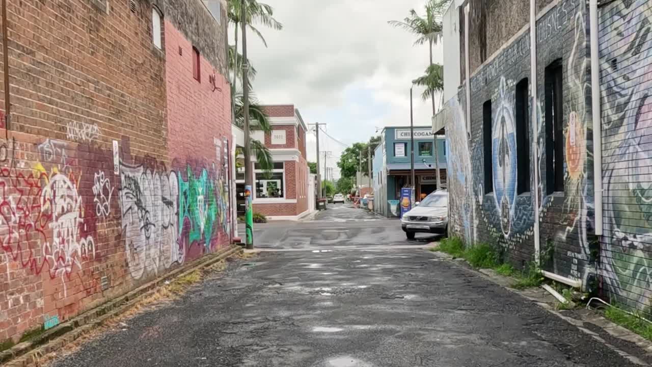 Graffiti-lined alleyway evolves into a cleaner space