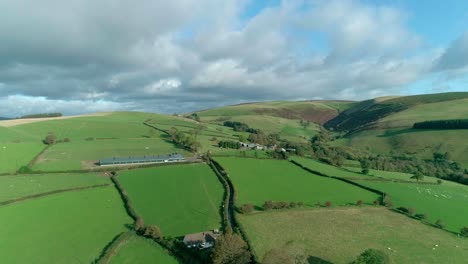 aerial moving across a countryside hilly area in mid wales