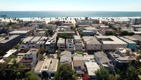 aerial upwards over residential neighorhood oceanfront in venice beach, california