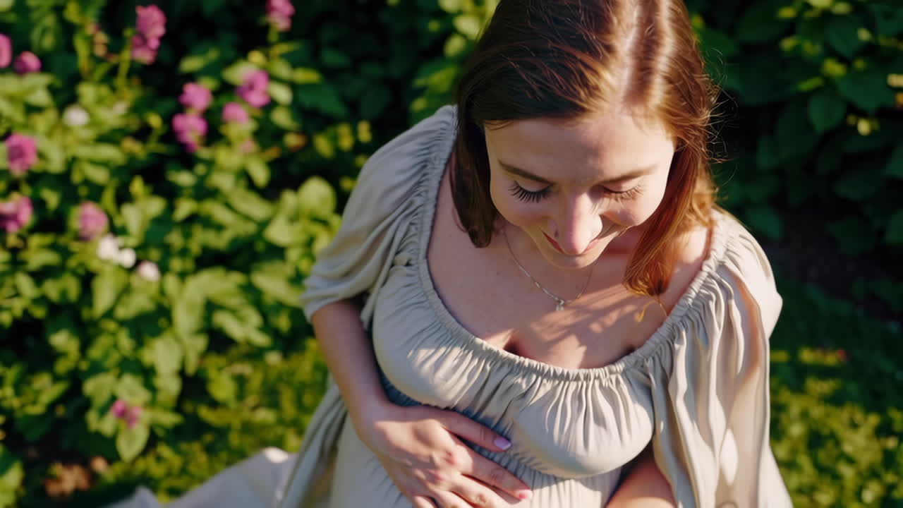 Pregnant Woman in a Sunny Garden