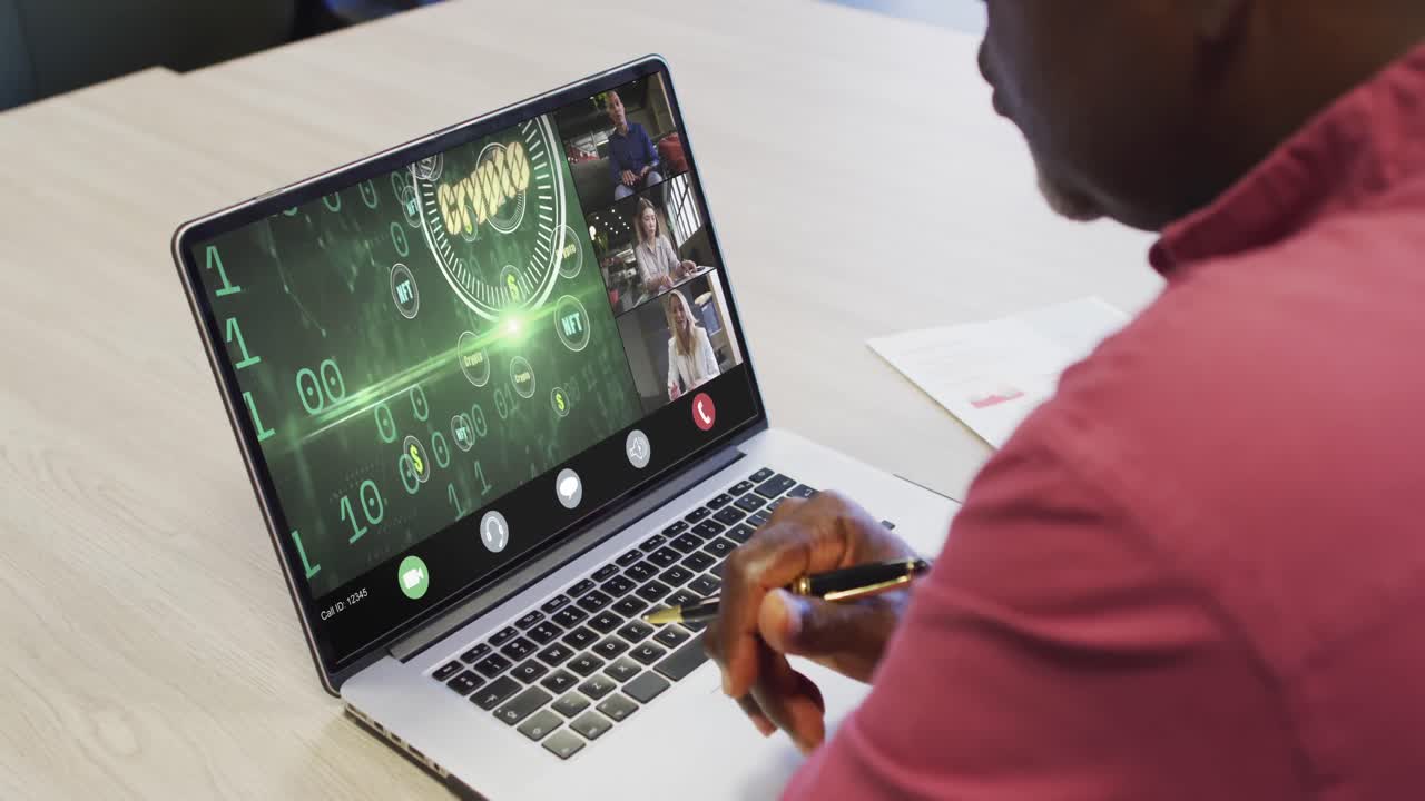 African american businessman using laptop for video call with diverse business colleagues