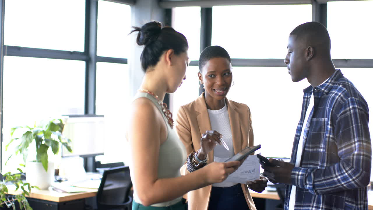 Diverse business people talking and working together in office, slow motion, copy space