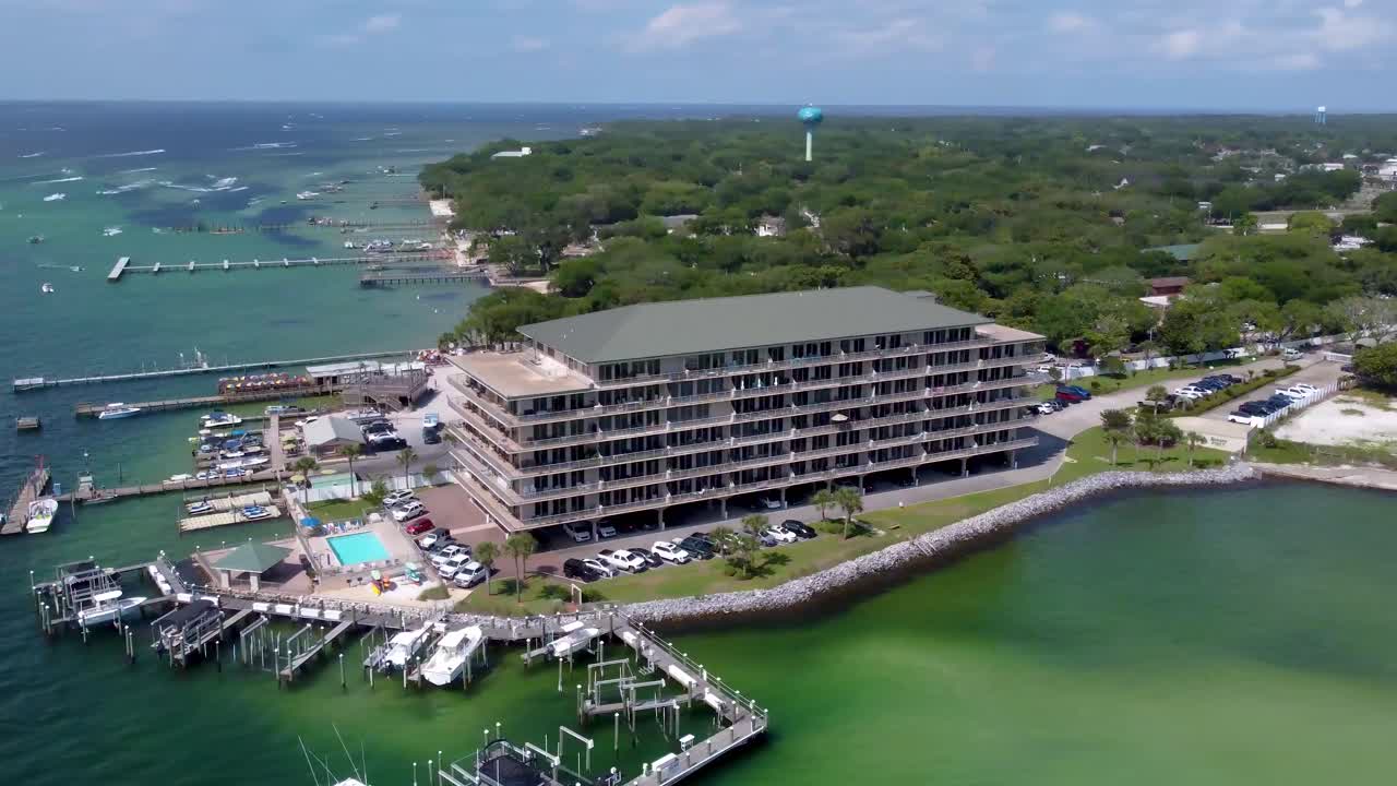 Destin Marina Aerial view. Boats and yachts on the east pass gulf of mexico. Beautiful Crab island and Destin Town with boat ramps on the East Pass,