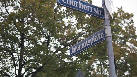 johannisplatz and chorherrstrasse crossroad street sign in munich, germany