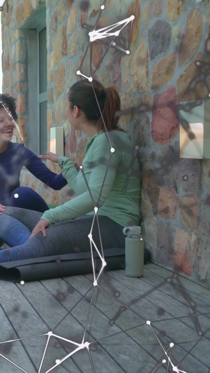 Vertical video: AR overlay appearing as woman in mint top turning, gesturing and holding hand, tech