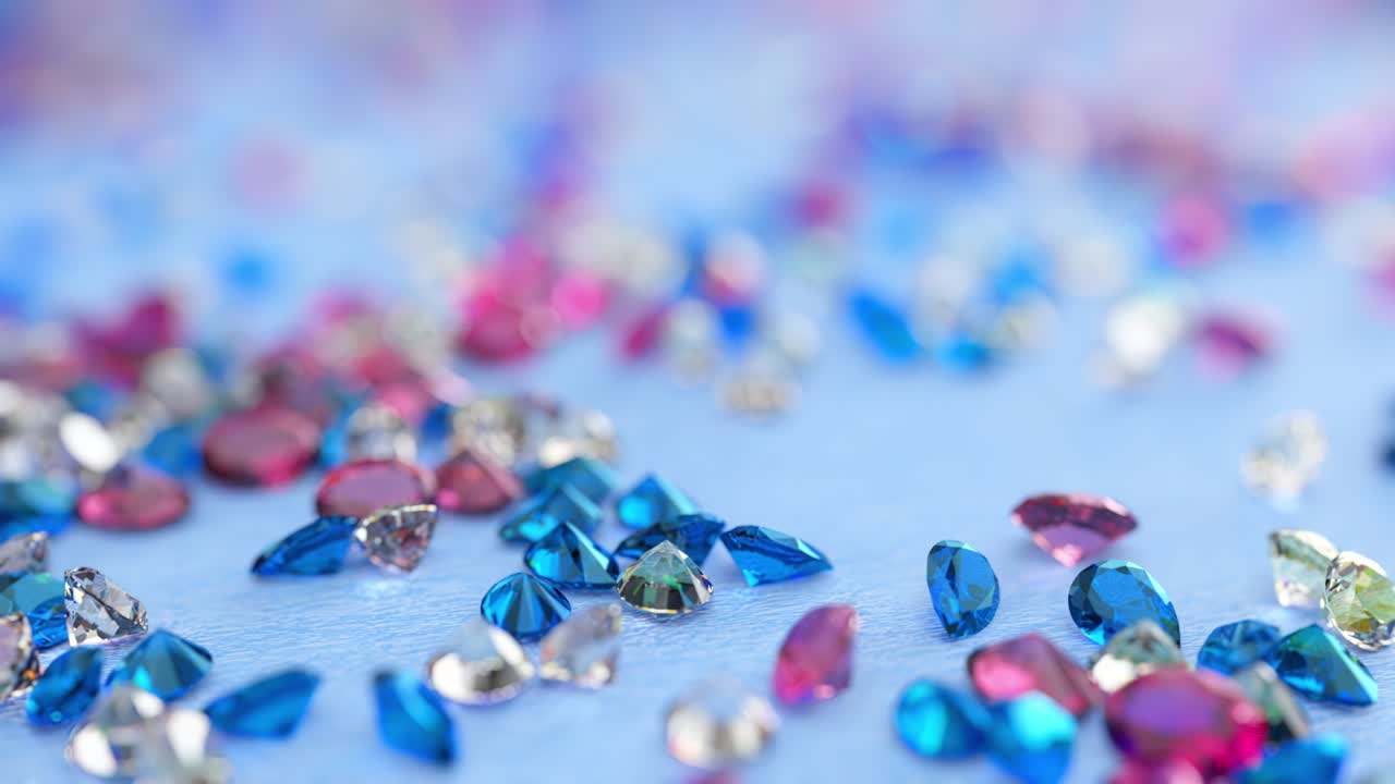 푸른, 분홍색 및 무색 토파즈가 밝은 파란색 배경에 떨어집니다.