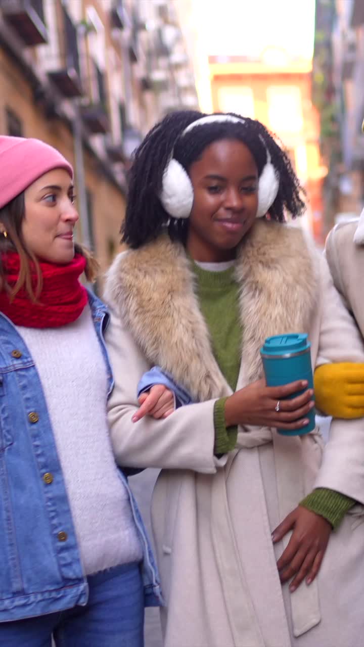 Friends Walking on City Street in Winter