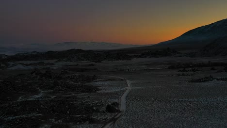 Cars-Driving-On-Snowy-Road-In-Alabama-Hills,-California-At-Sunset