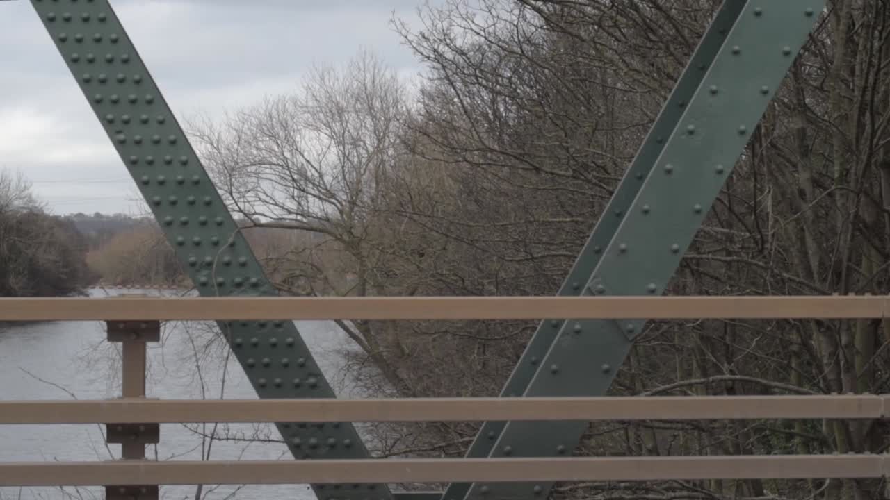 Bridge over a river showing railings and metal supports