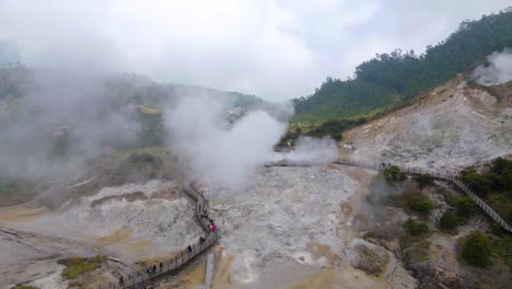 Sikidang-Crater-emits-massive-amount-of-sulfur-smoke,-aerial-orbit-view