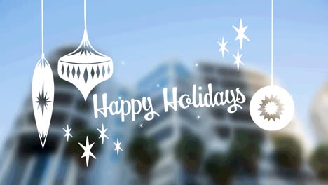 happy holidays text with christmas hanging decorations against tall buildings in background