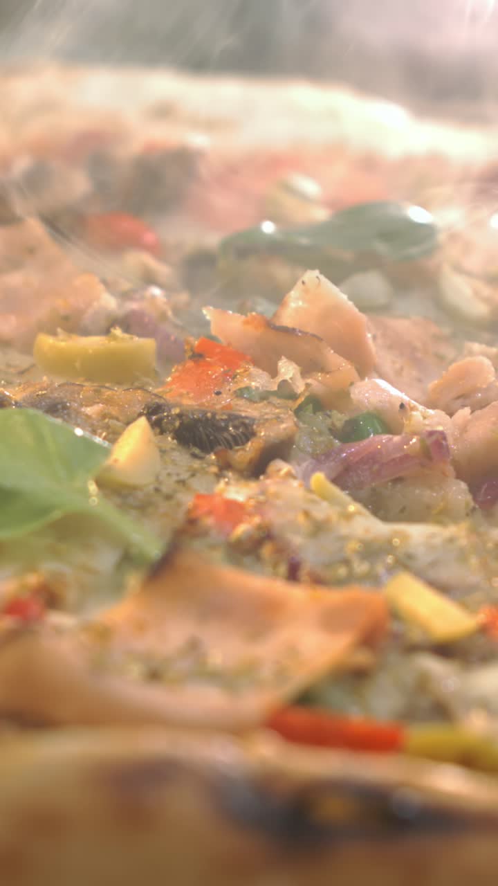 Close up of a steaming pizza
