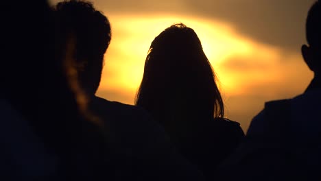 couple taking photo at sunset