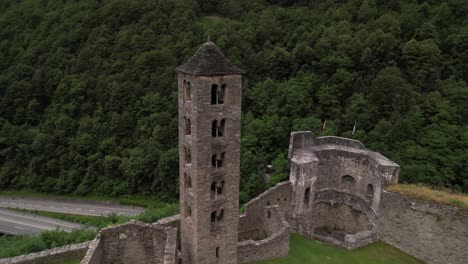 aerial around old medieval clock tower in a castle in mesocco, switzerland