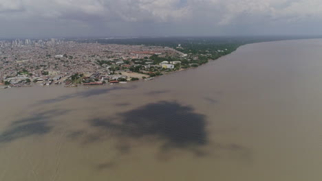 aerial shot showing transition of belem city to amazon forest and river