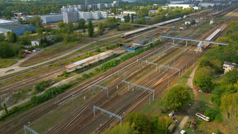 almost empty tracks by the houses lie, quiet beneath the warsaw city sky