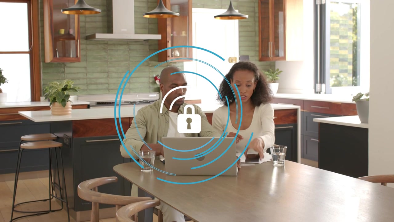 Security ring showing while woman holding phone, man comparing phone with laptop, securing account