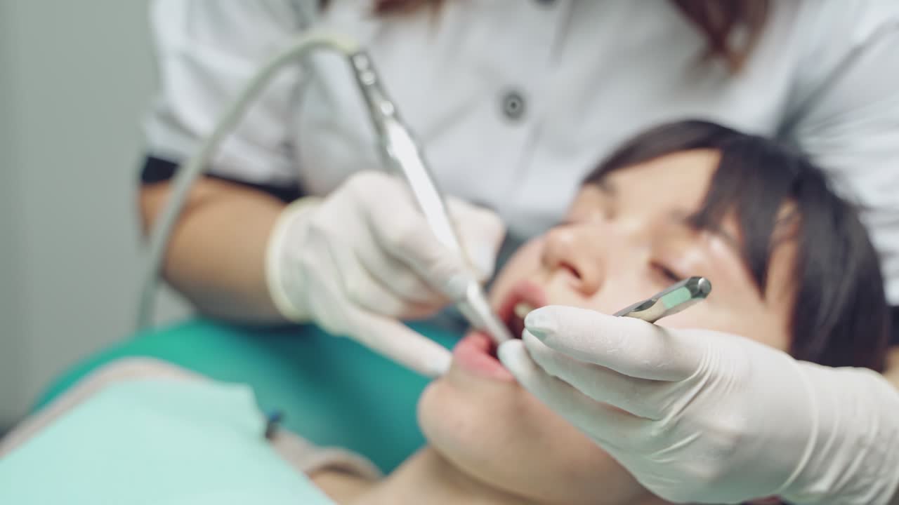 Dentist and patient in dentist office. Teeth care.