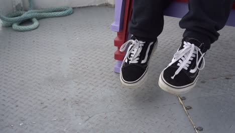 Girl-shaking-her-feet-sitting