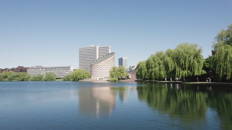 Capture-the-Copenhagen-Planetarium-and-its-picturesque-surroundings-in-a-delightful-video,-filmed-from-the-serene-lakeside