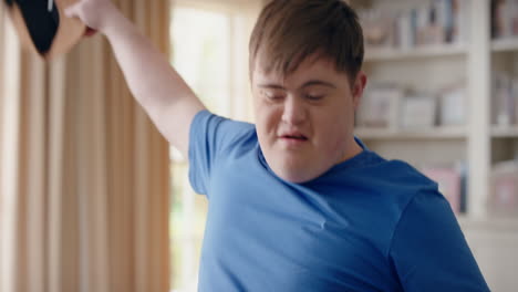 funny-teenager-boy-with-down-syndrome-dancing-in-living-room-special-needs-kid-having-fun-celebrating-with-silly-dance-moves-enjoying-happy-weekend-at-home-4k