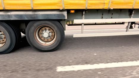 yellow truck travels on highway in birmingham