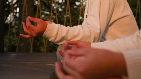 person meditating in a peaceful outdoor setting