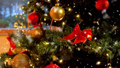 close up of a christmas tree decorated with red and gold ornaments and lights