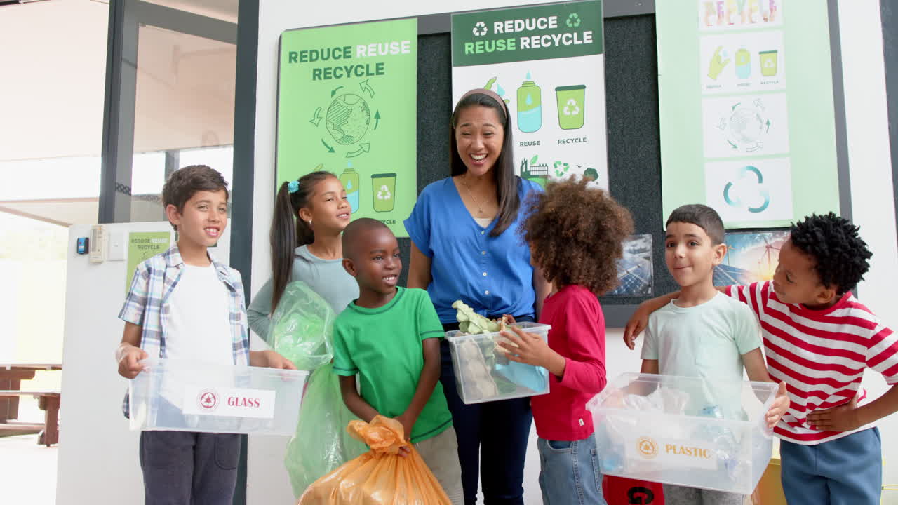 In school, teacher and children recycling plastic, glass, and paper together