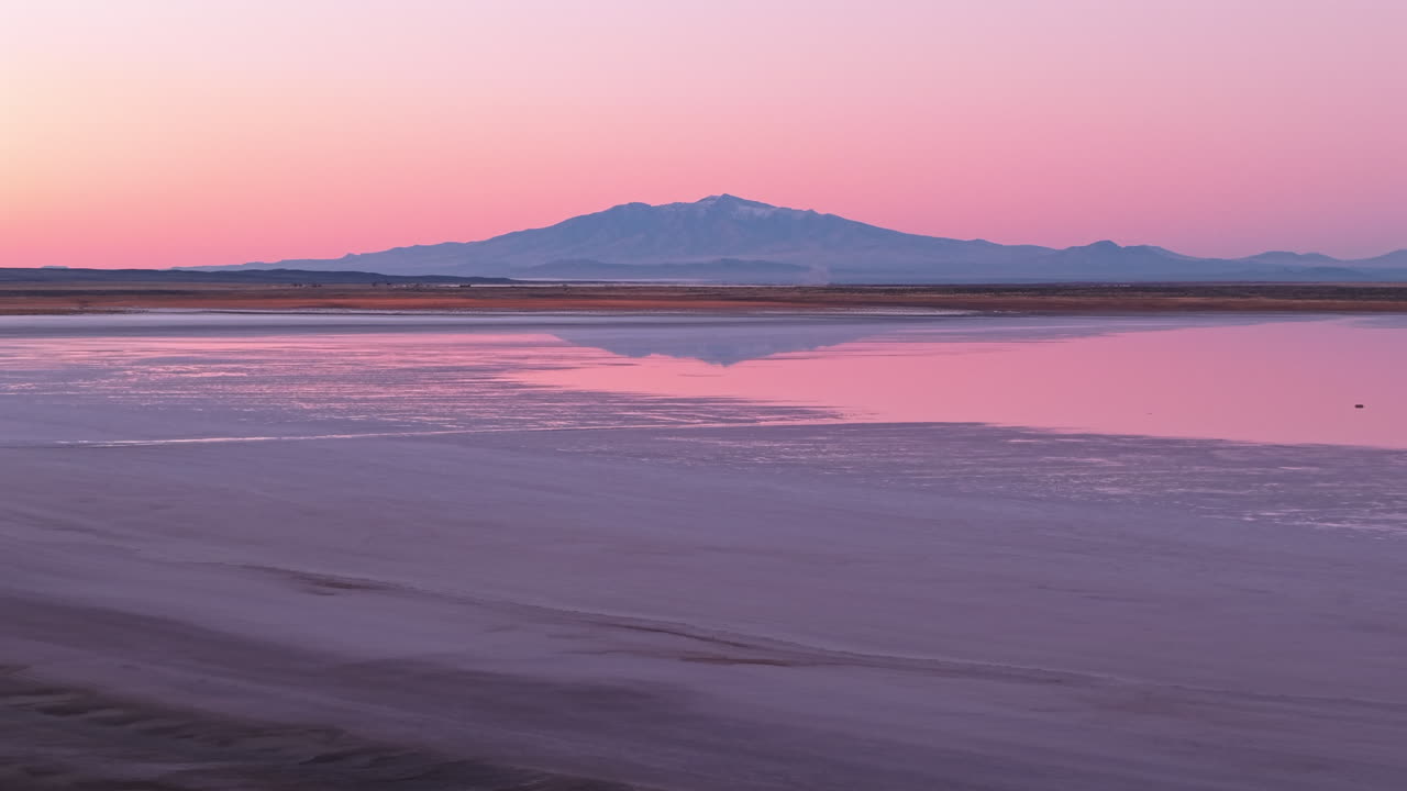 Aerial view of Salinas del Diamante national protected area and open-air salt flat at sunset, Mendoza, Argentina.