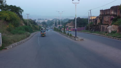 highway to jos town in the north-central region of nigeria - descending aerial