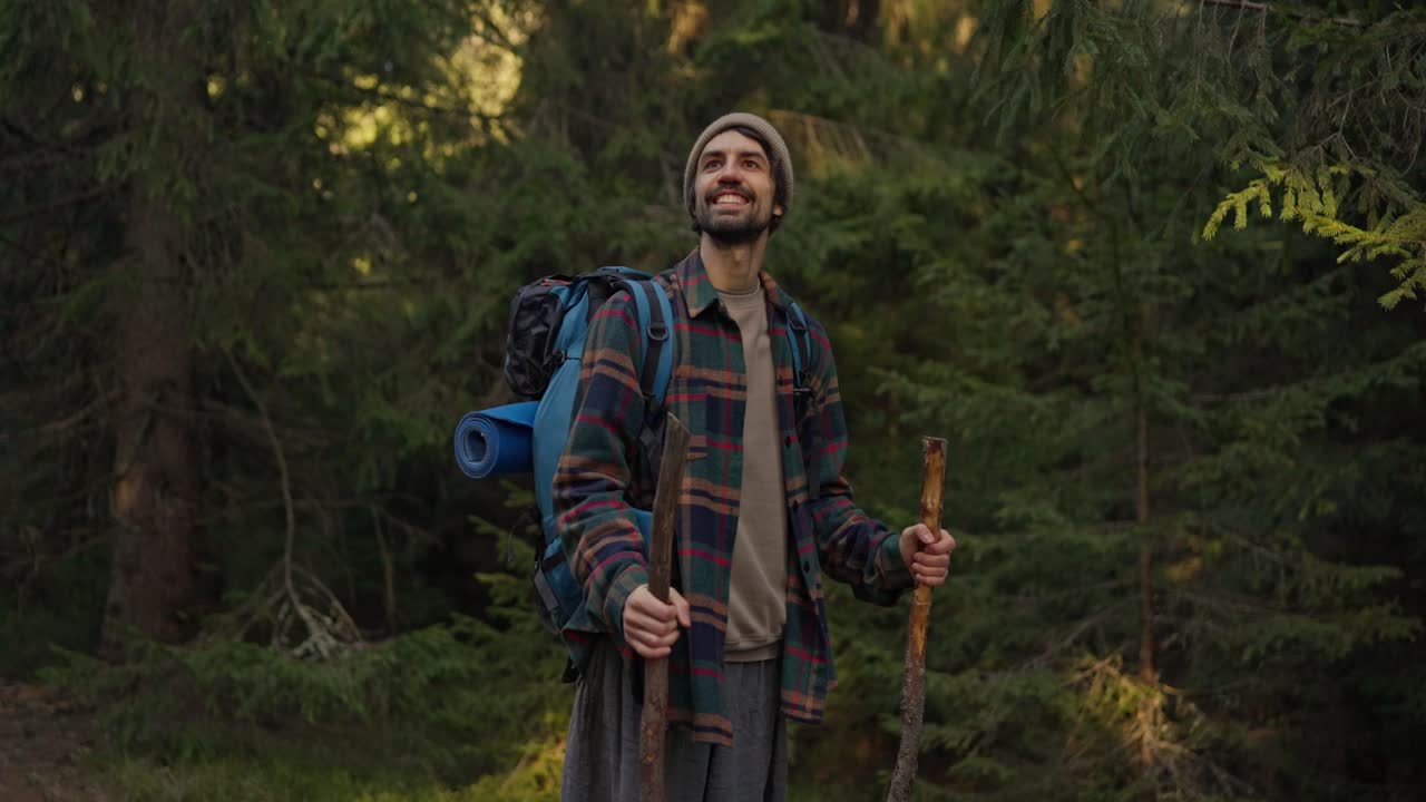 Hiker in a forest with backpack