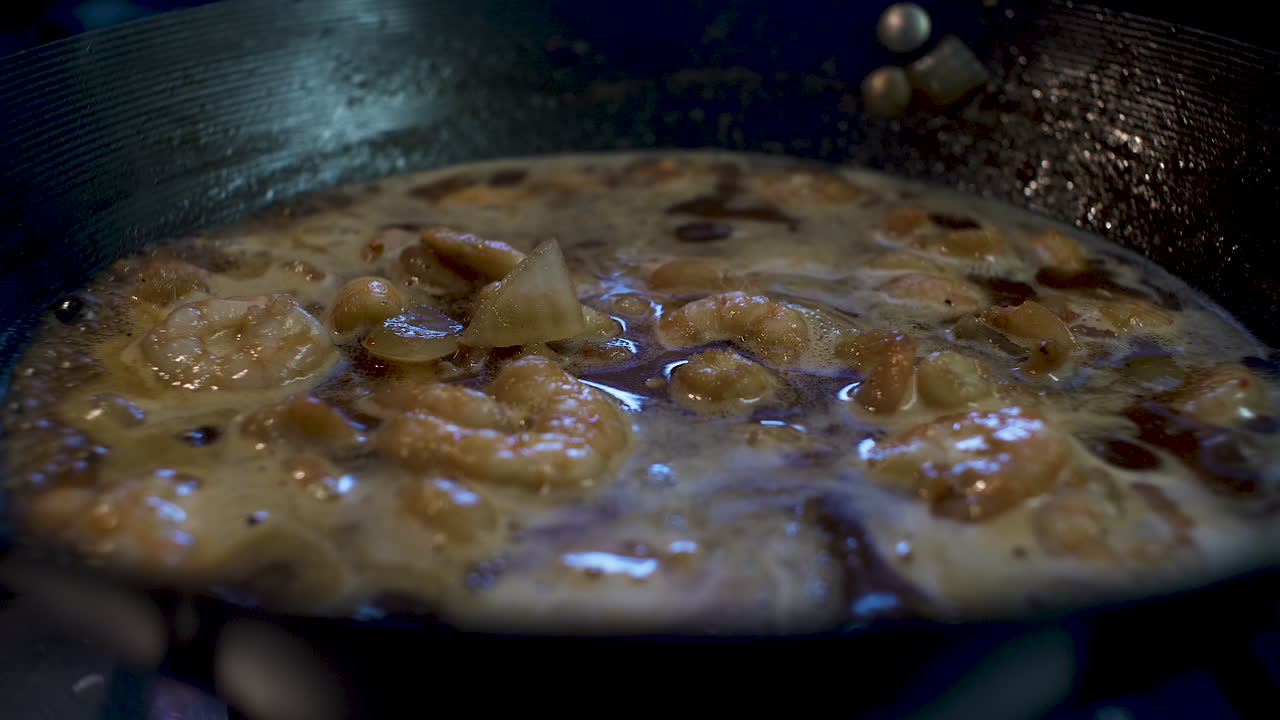 Prawns In Simmering Bubbling Sauce Inside Wok