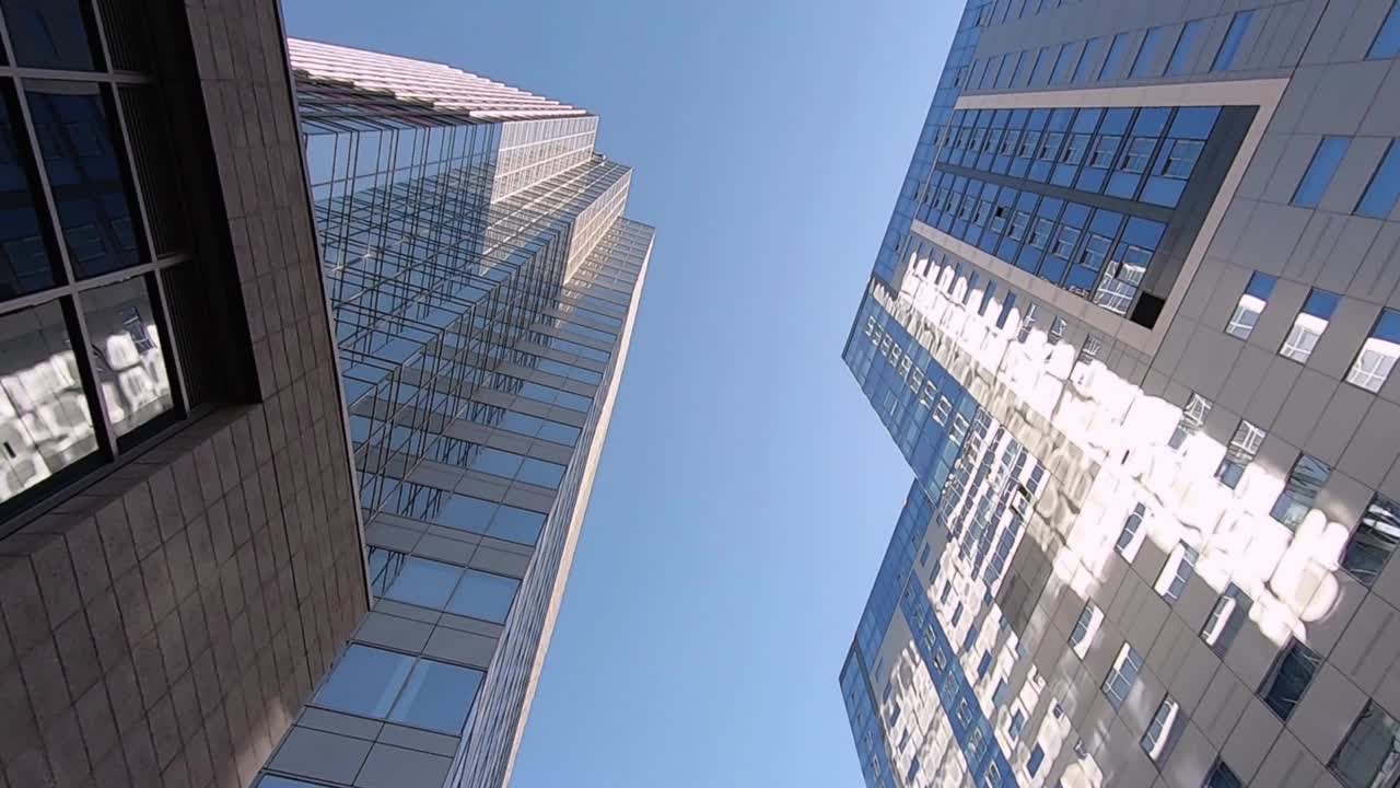 A tilt-up from the street level between high rises of glass and steel, Phoenix, Arizona
