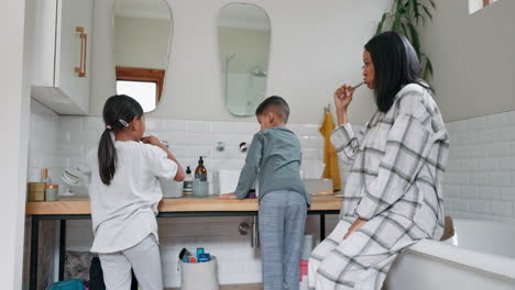 mom, children and brushing teeth in bathroom