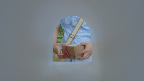 hands of courier putting parcel boxes into mailbox