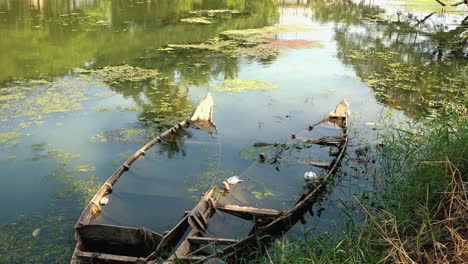 Medium-Shot-of-Sunken-Boat-in-a-River