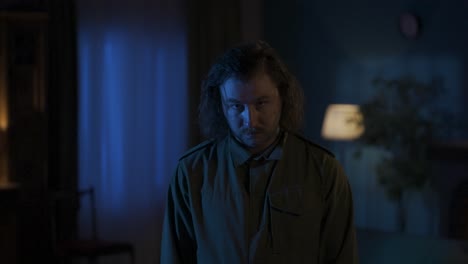 mysterious man in a dimly lit room