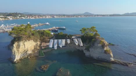 aerial drone footage of a beach club on cameo island in zakynthos, greece