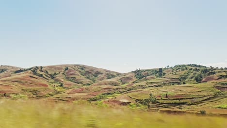 The-view-from-the-bus-or-car-on-the-beautiful-scenery-with-hills-and-forest-before-on-sunny-day