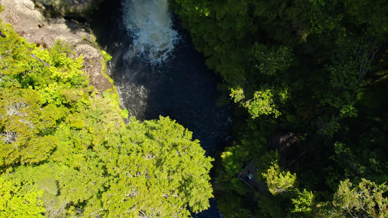 Topdown view of Rio Bravo waterfall surrounded by lush Vegetation at Tepuhueico Park, Rotating shot